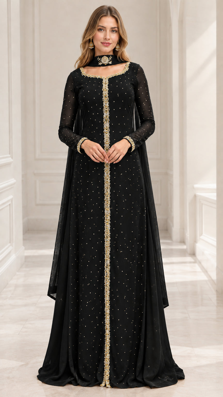 Model wearing black long sleeve embellished maxi evening gown with cape drape