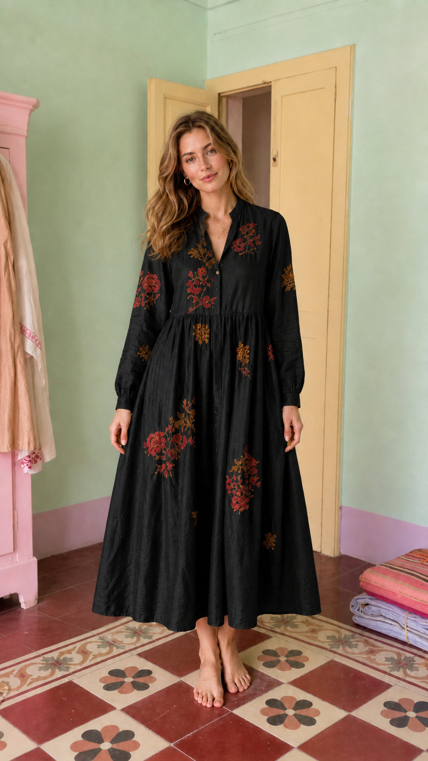 Front view of model wearing black embroidered midi dress