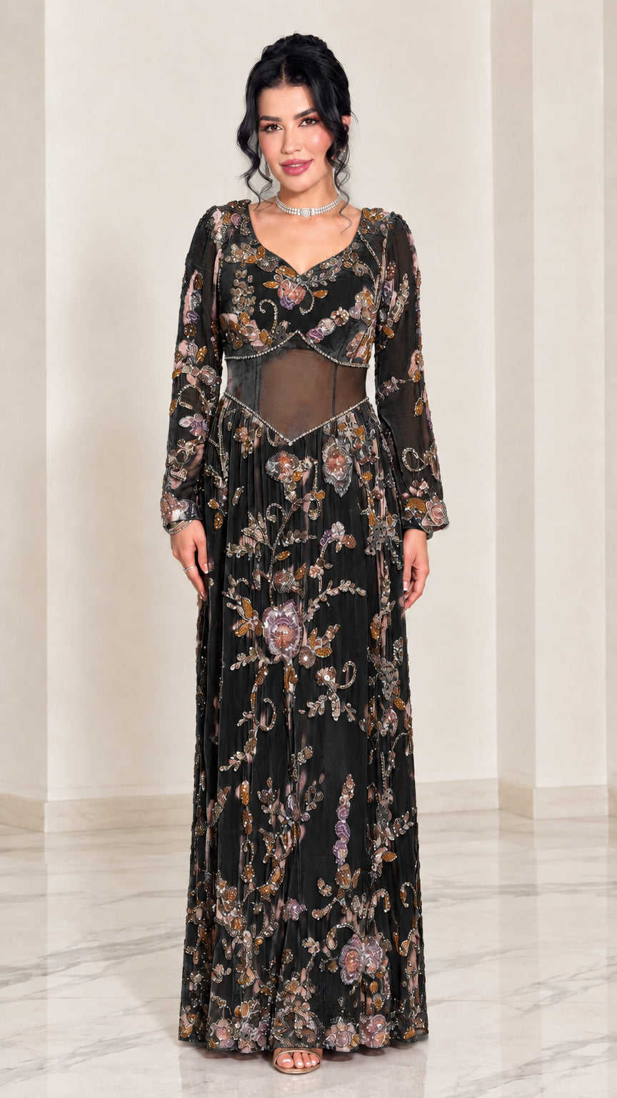 Full-length front view of black embroidered illusion waist evening maxi gown