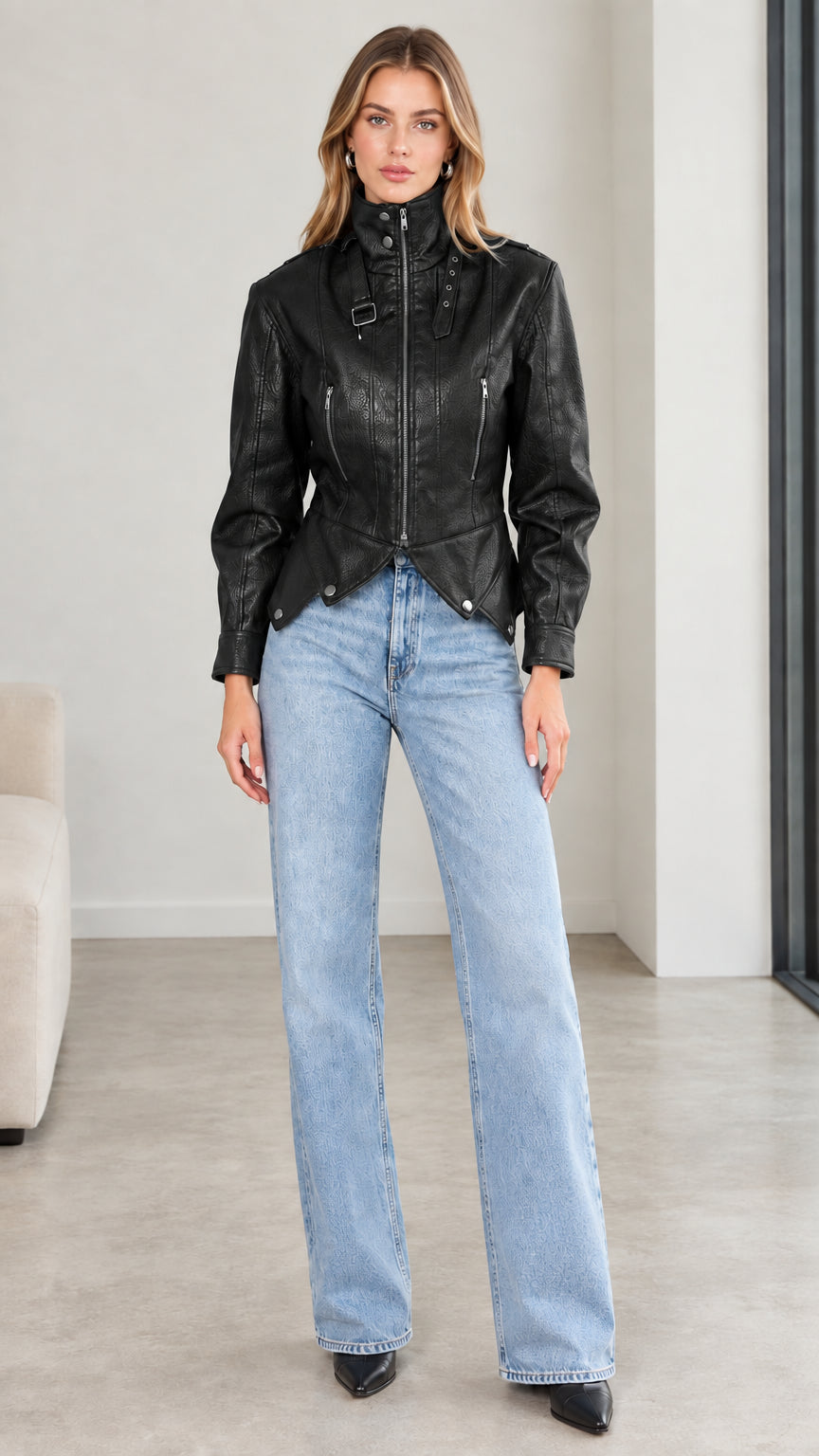 Front view of model wearing black high neck buckle faux leather jacket