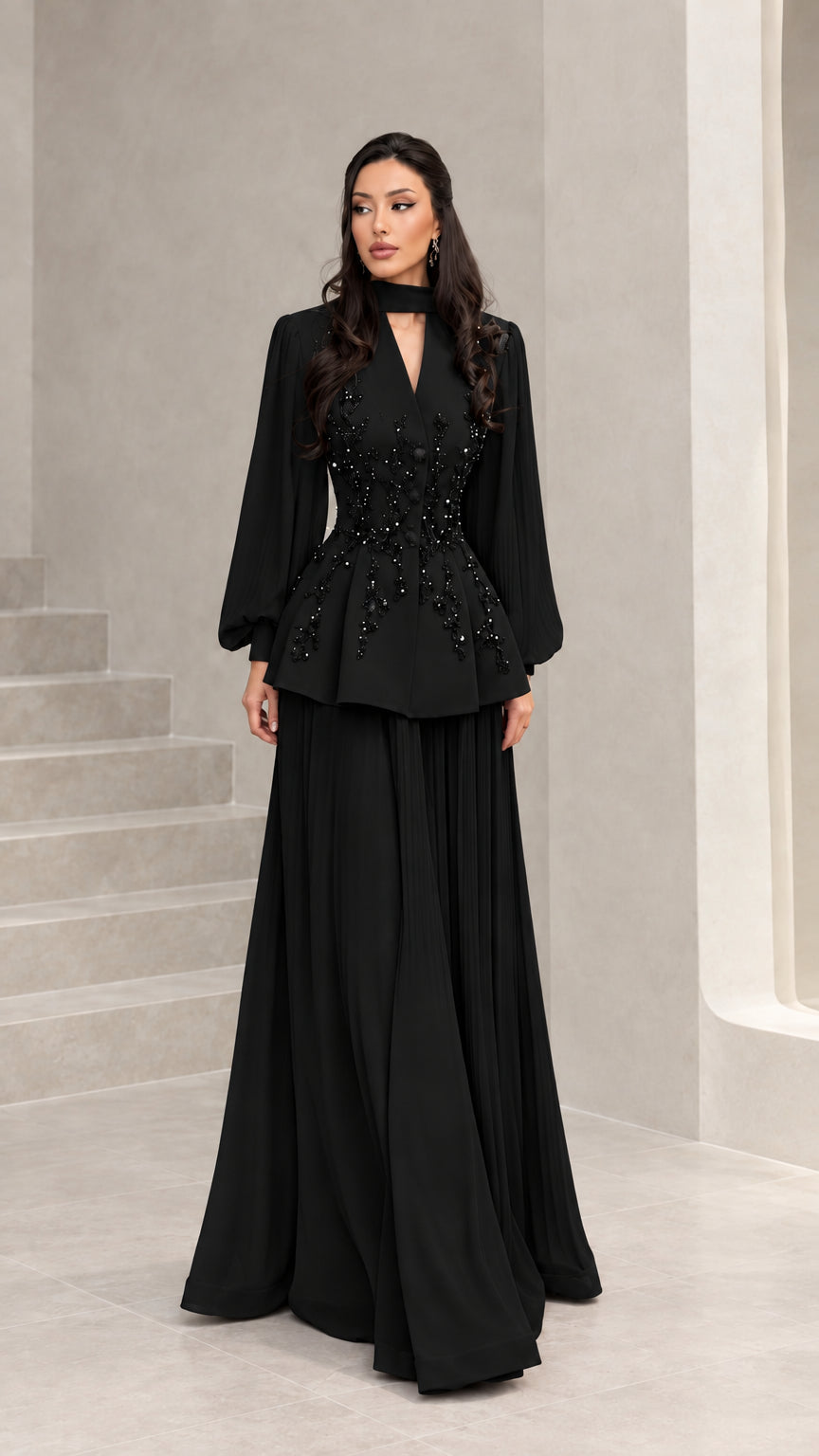 Front view of black long-sleeve beaded peplum formal evening gown