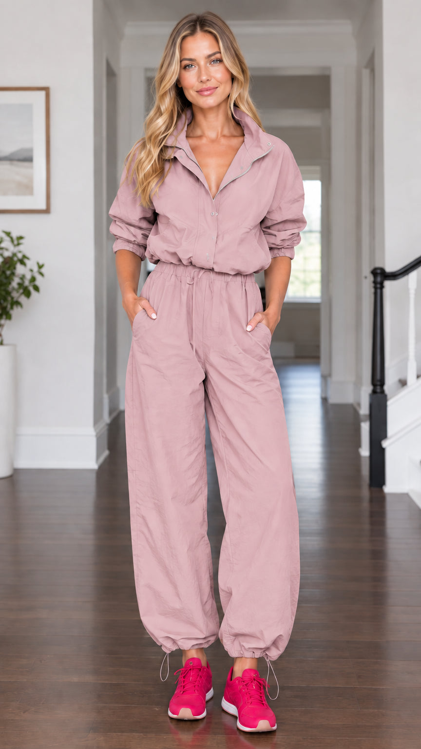 Model wearing dusty rose pink casual long sleeve utility parachute jumpsuit