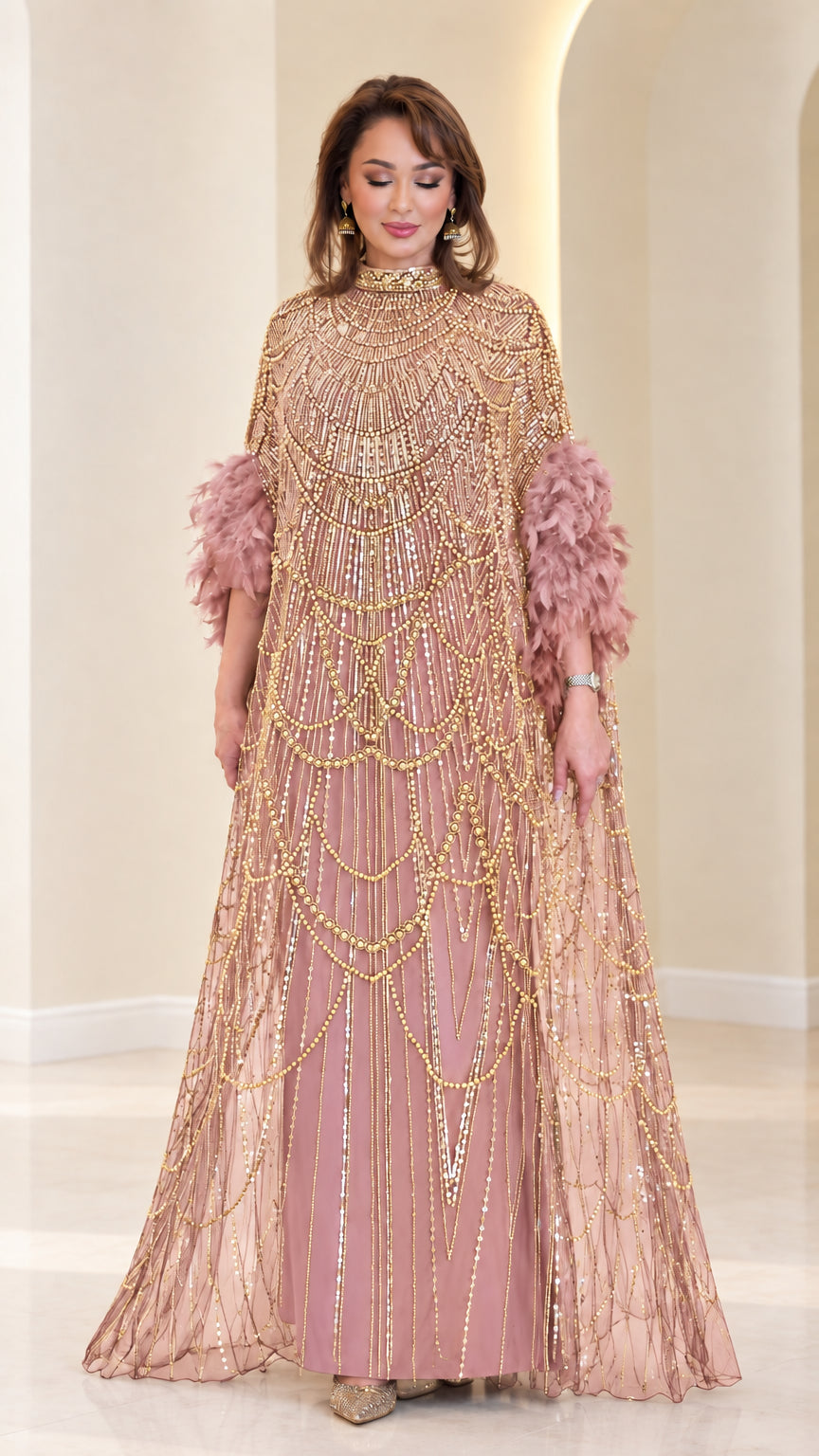 Dusty pink beaded cape evening gown with feather trim