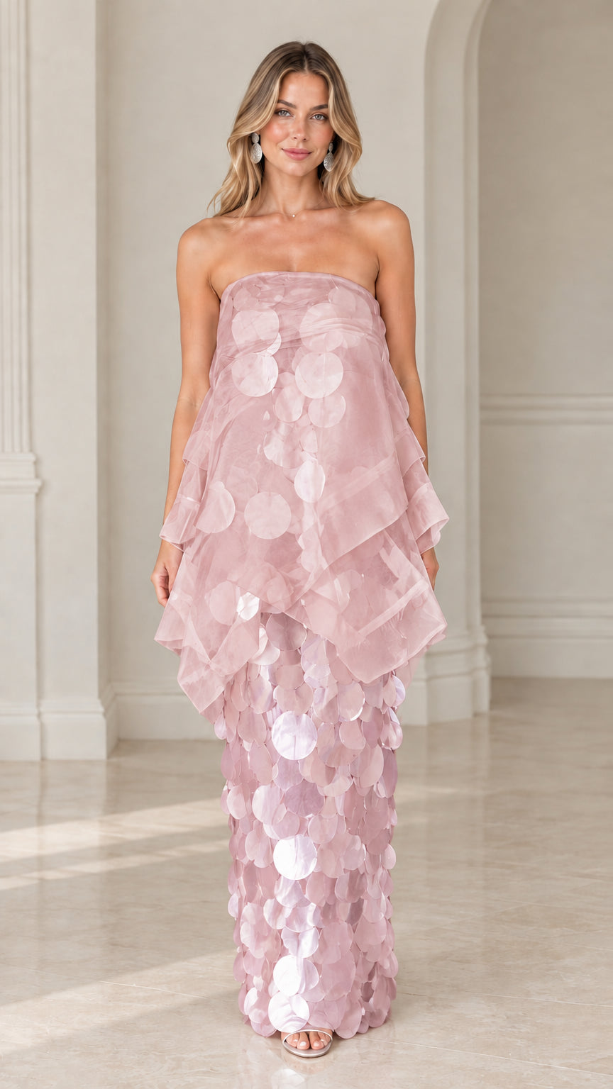 Front view of model wearing blush pink strapless tiered organza paillette maxi dress