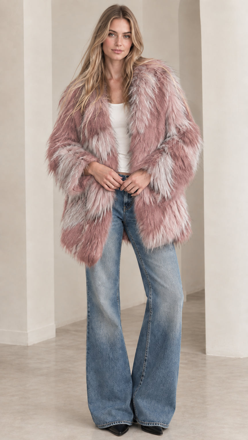 Model wearing dusty pink and grey chevron shaggy faux fur coat