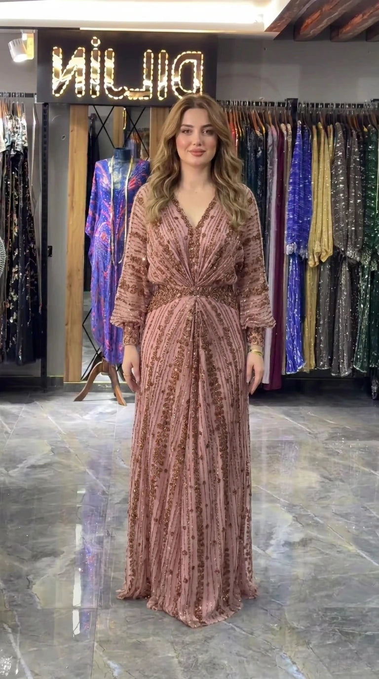 Dusty rose sequin embellished long-sleeve evening maxi dress on model