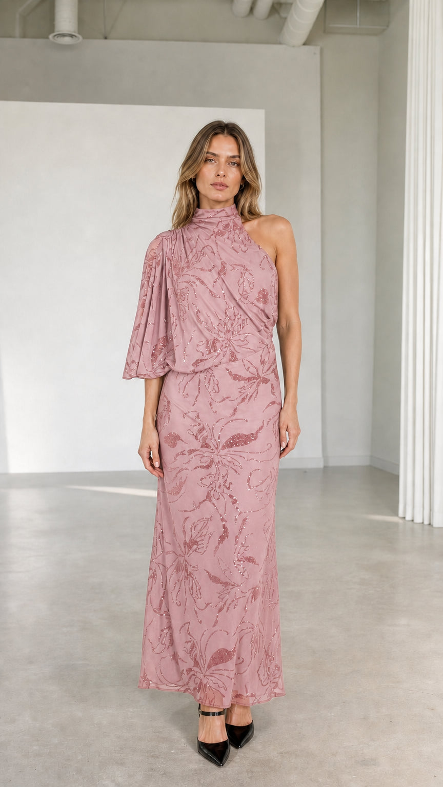 Model wearing dusty rose pink one-shoulder high neck embellished formal dress