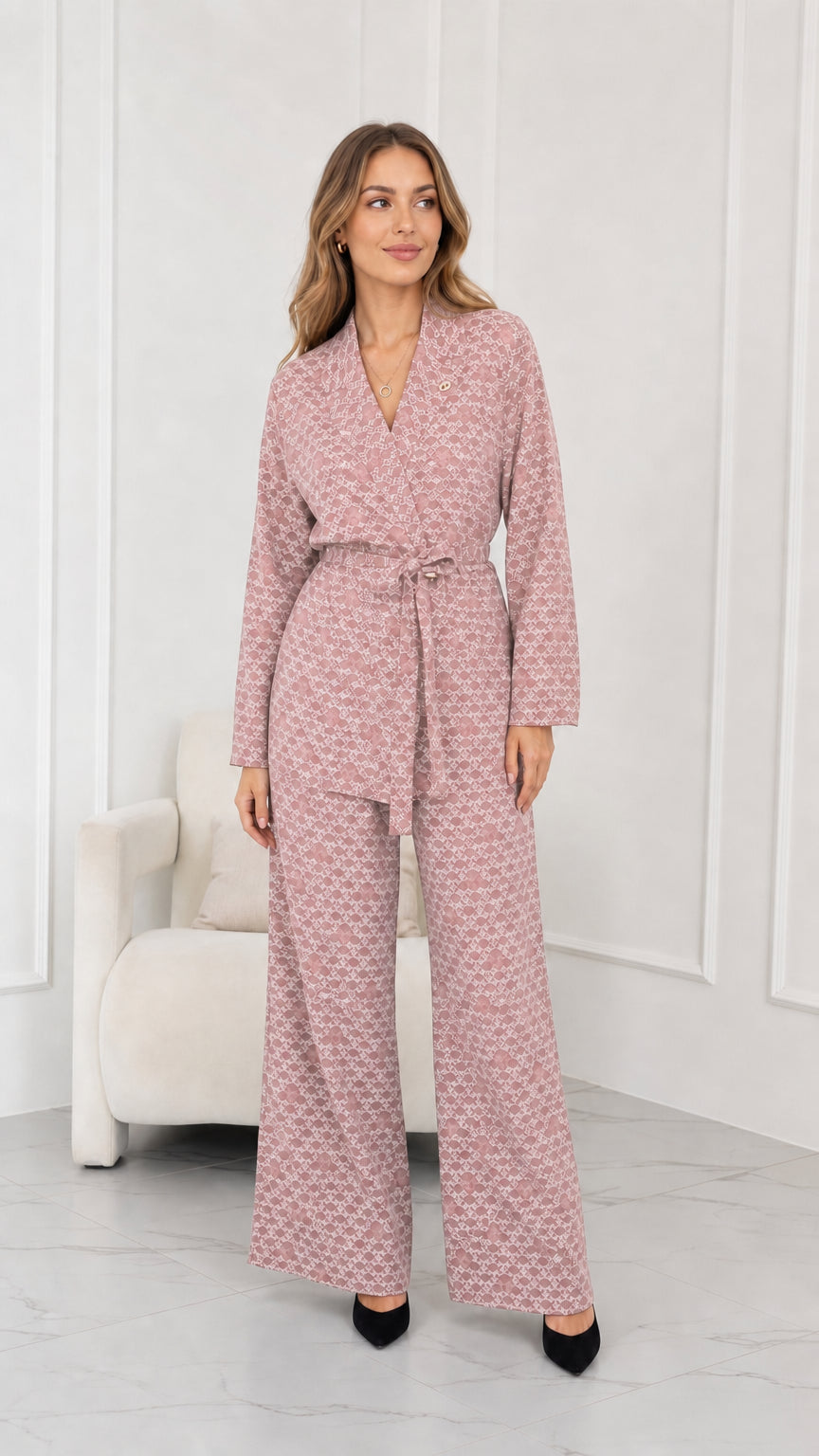 Model wearing dusty pink geometric print belted blazer and wide-leg trousers