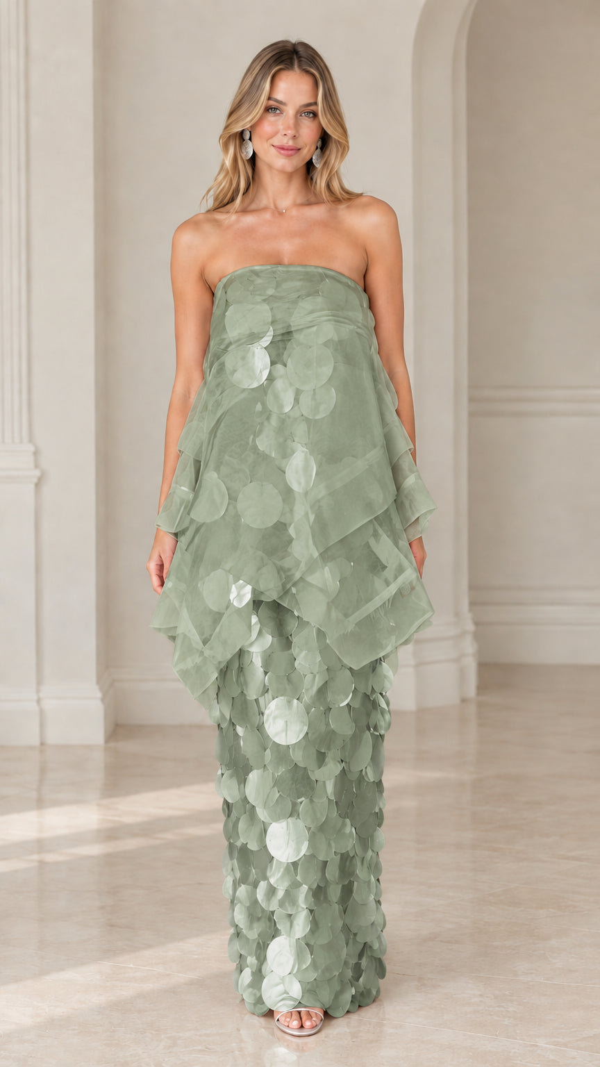 Front view of model wearing sage green strapless tiered organza paillette maxi dress