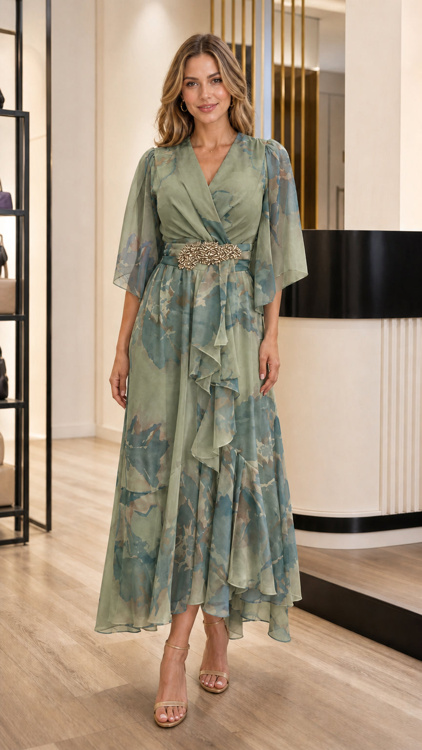 Model wearing Sage Green floral chiffon evening dress with crystal waist detail