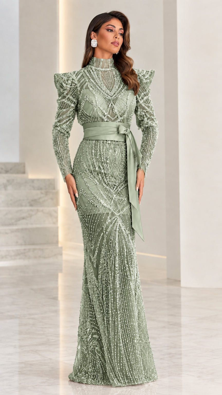 Model wearing sage green beaded maxi evening gown with waist tie