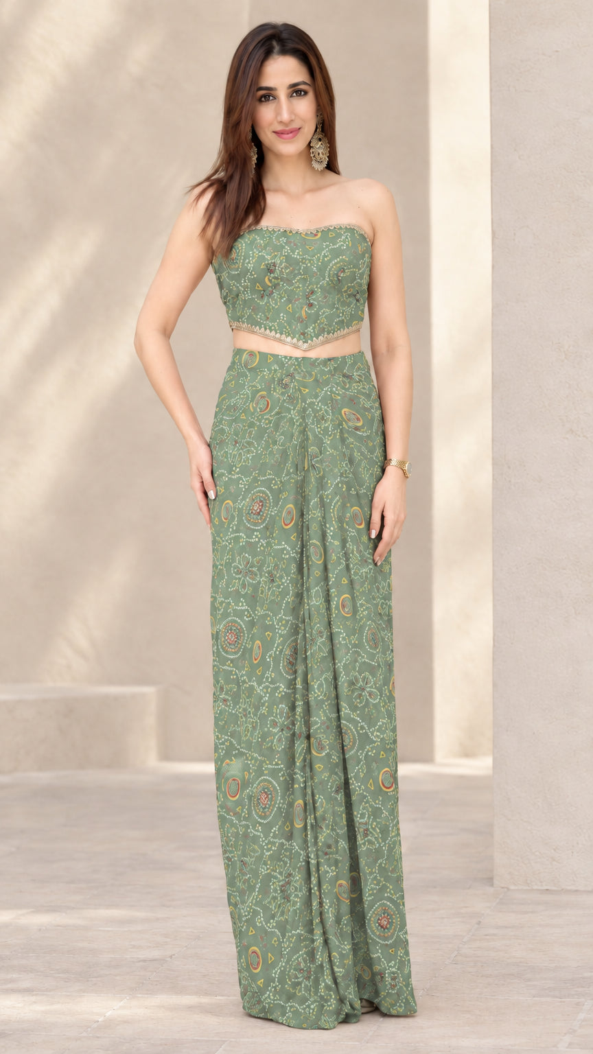 Woman wearing Sage Green printed strapless crop top and draped skirt co-ord set