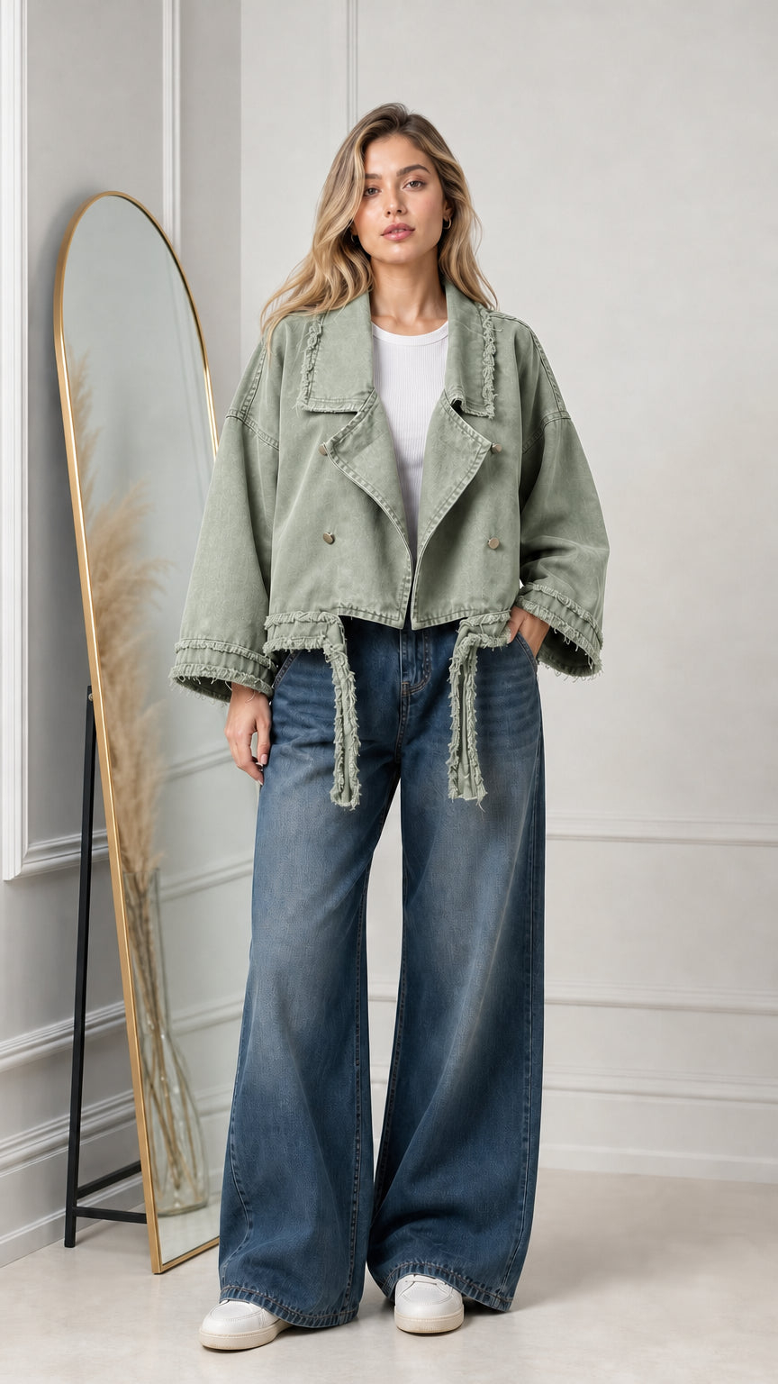 Model wearing sage green cropped casual twill moto jacket with fringe trim