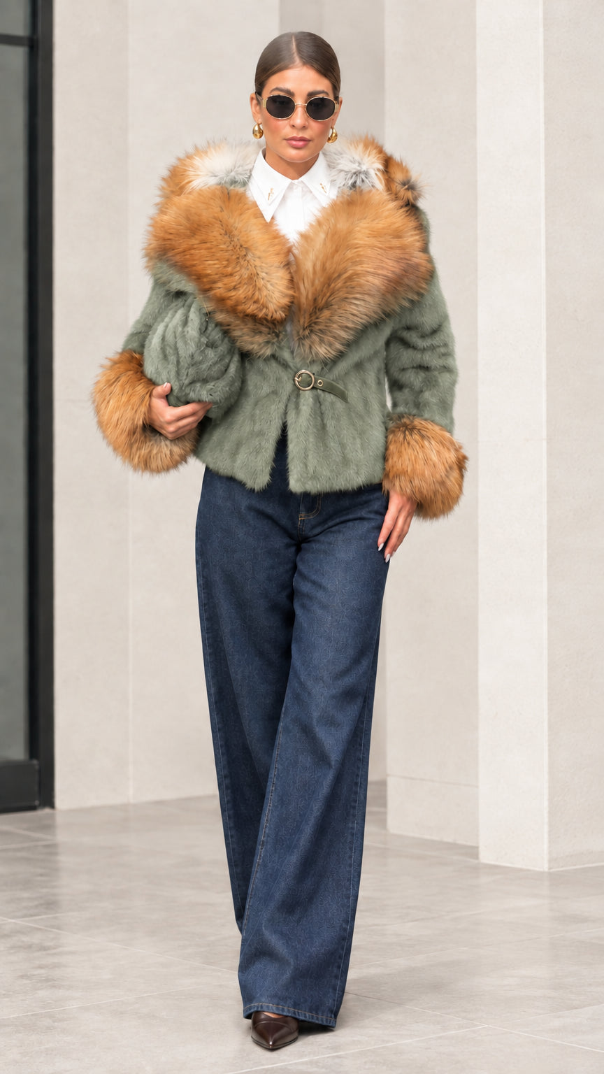 Woman wearing sage green plush jacket with warm camel faux fur collar and cuffs