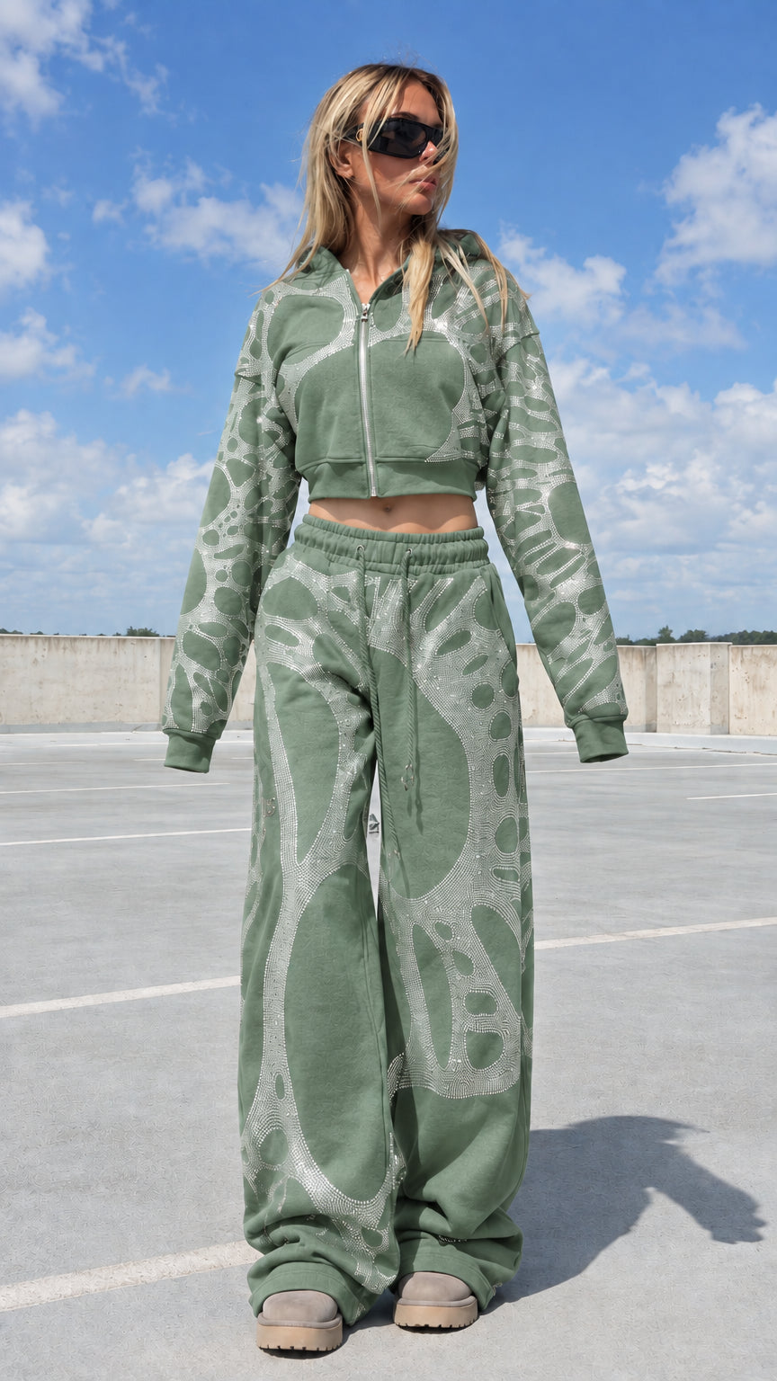 Model wearing sage green rhinestone graphic 2-piece hoodie and pants set