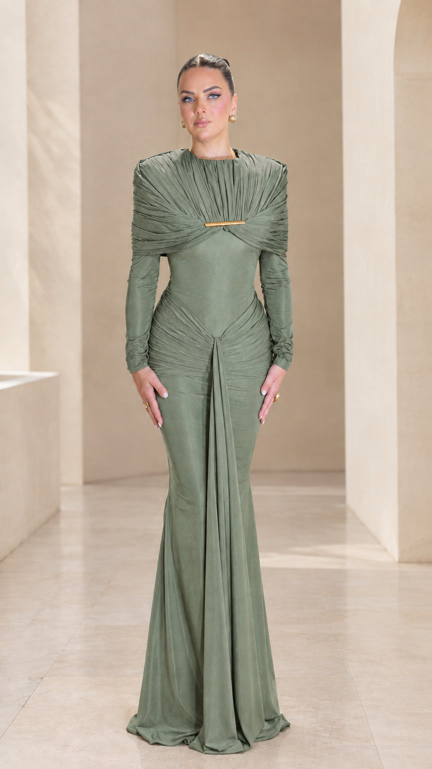 Front view of sage green long sleeve pleated cape evening gown