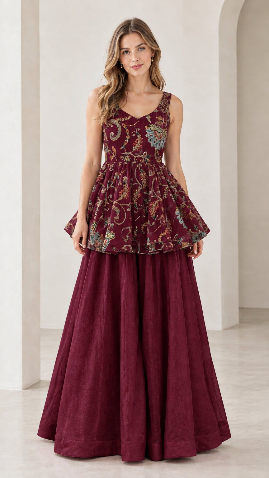 Front view of model wearing wine red floral embroidered peplum and palazzo set
