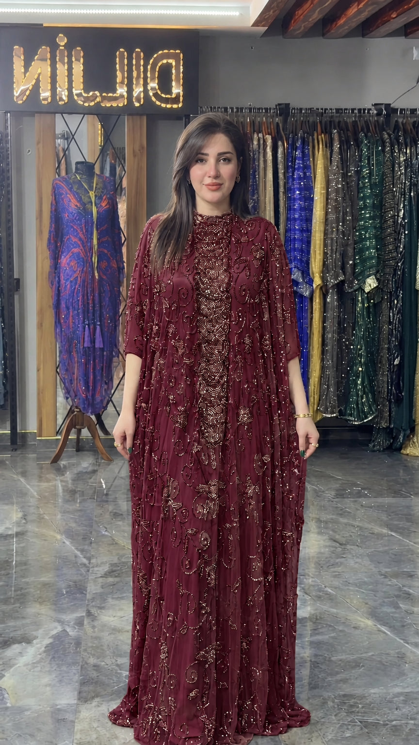 Front view of burgundy wine hand-beaded cape formal maxi dress