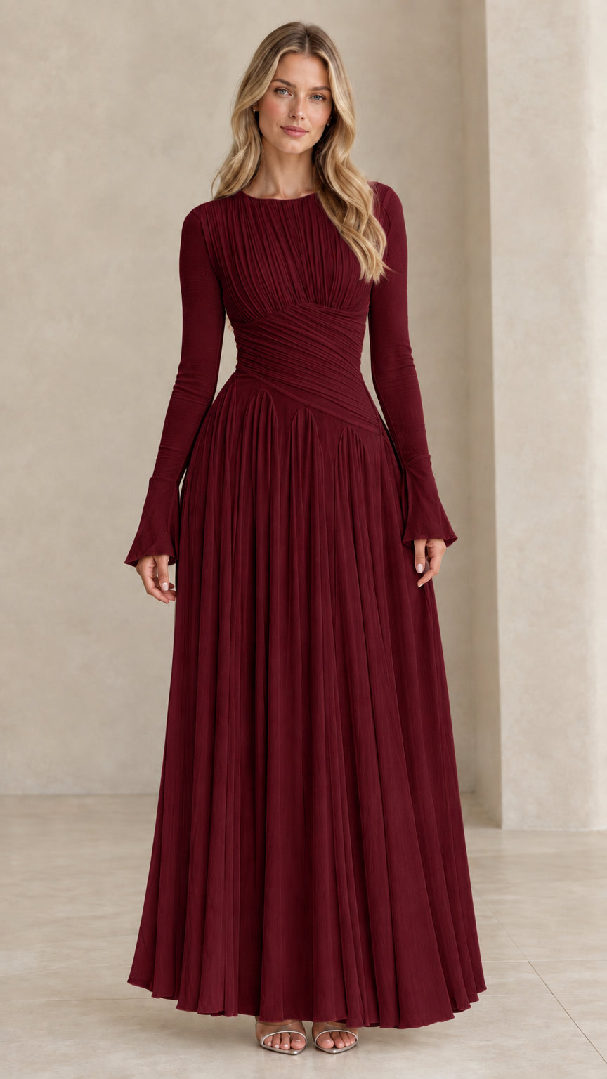 Model wearing burgundy red long sleeve pleated formal maxi dress