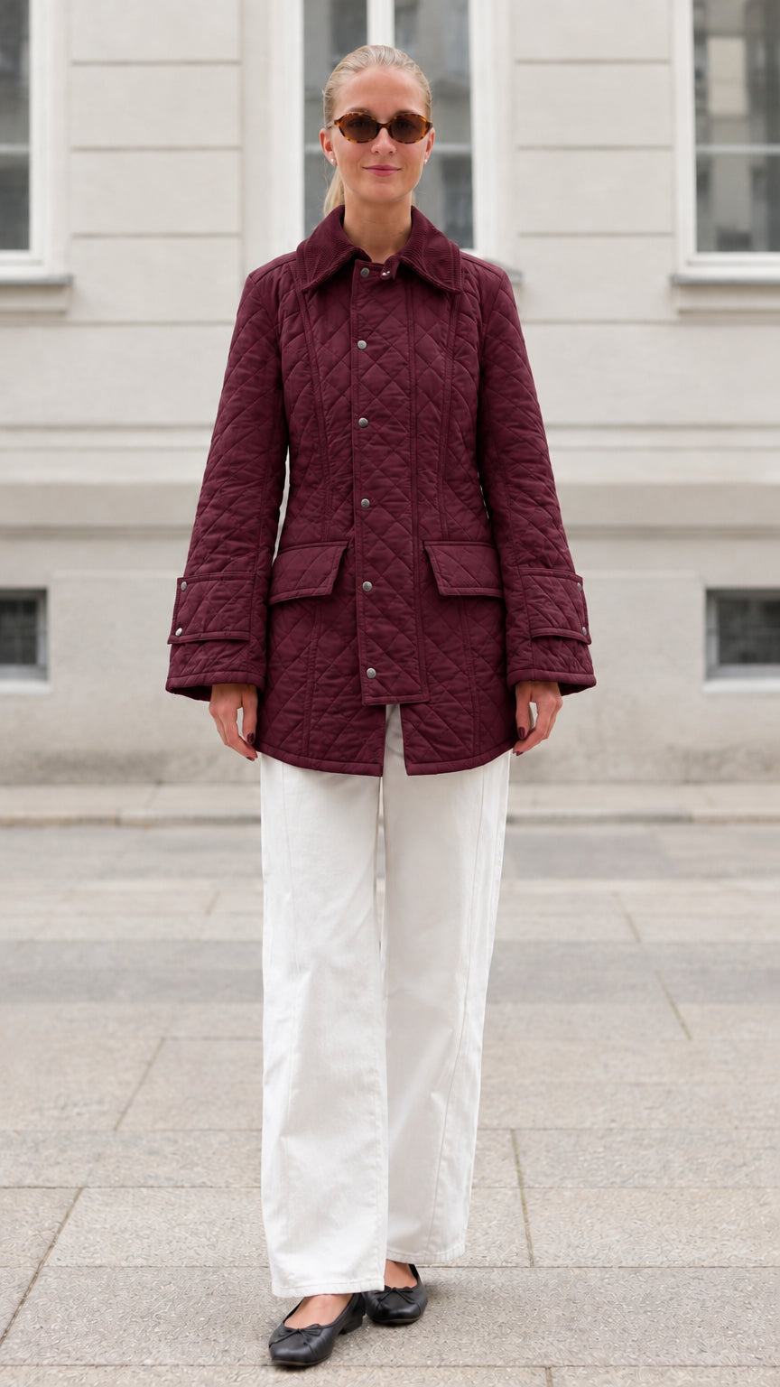 Front full-length view of woman wearing burgundy diamond quilted barn jacket