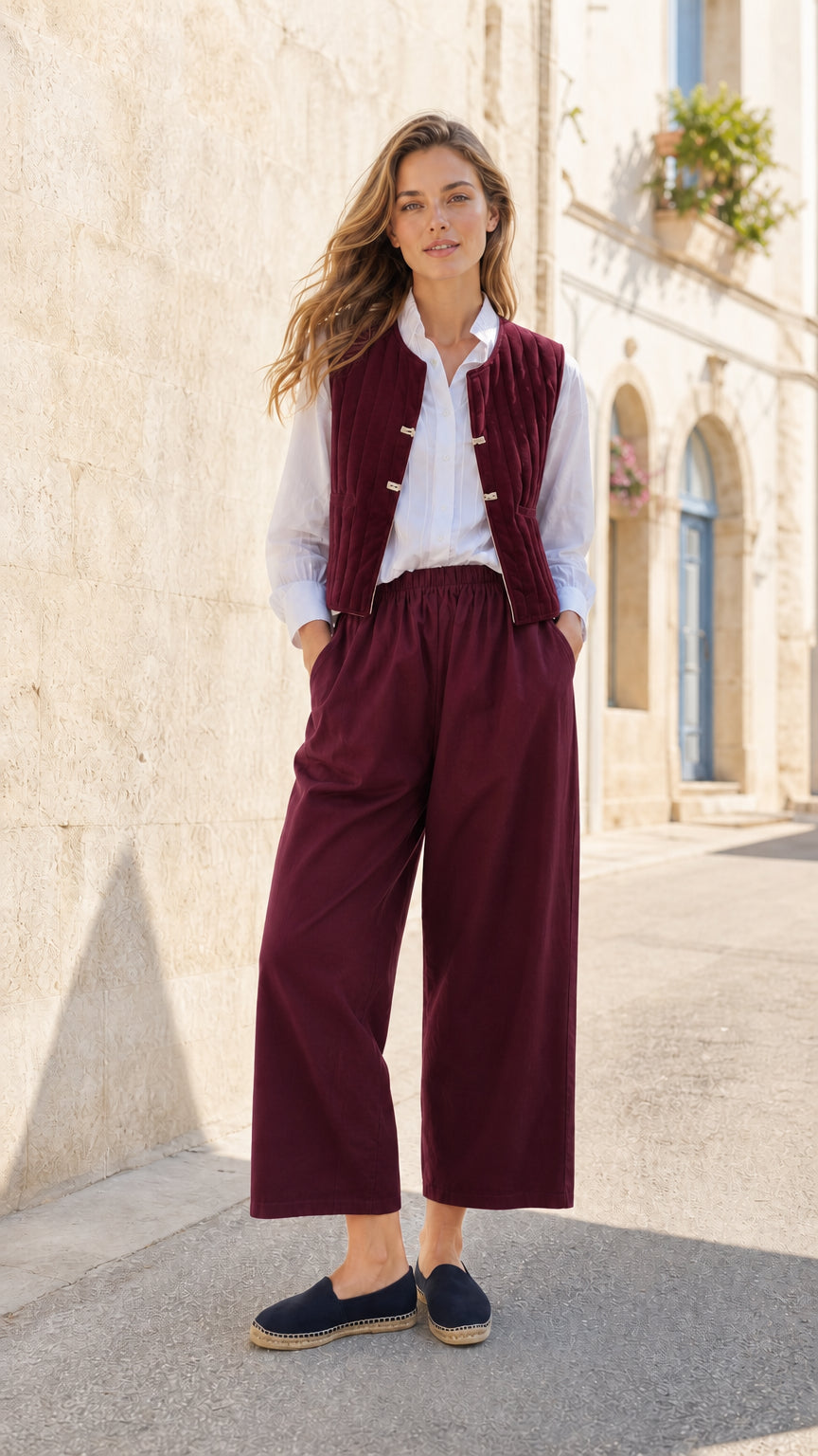 Woman wearing Burgundy quilted vest and wide-leg pants co-ord set