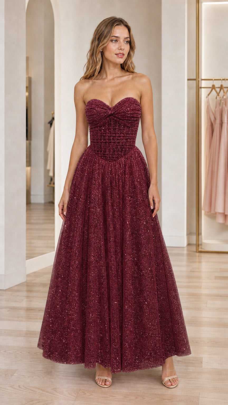Front view of burgundy strapless glitter tulle formal evening dress
