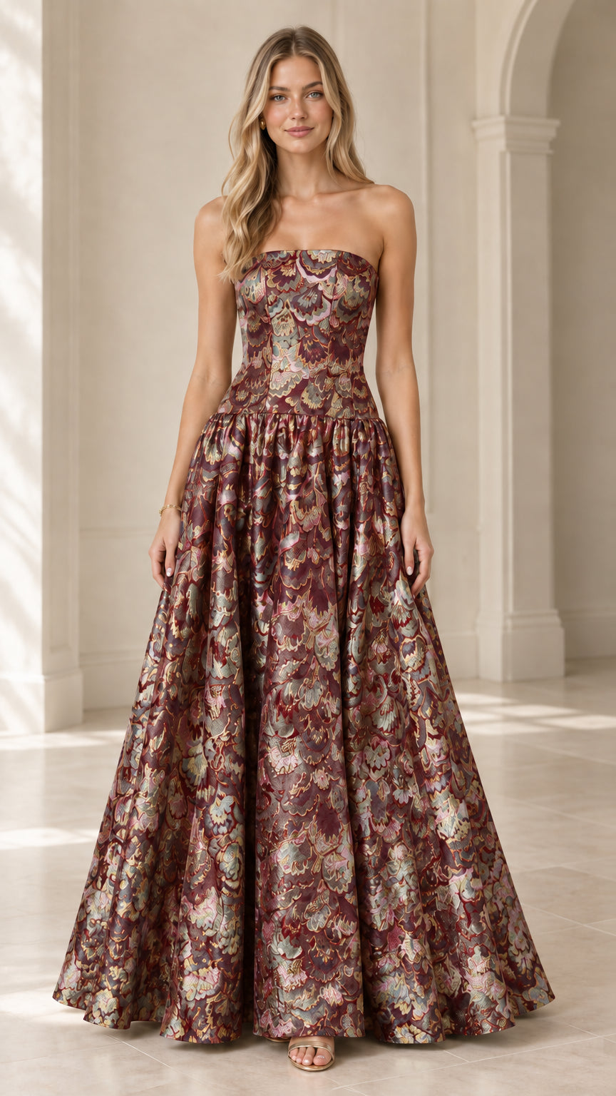 Model wearing strapless burgundy wine floral jacquard ball gown dress