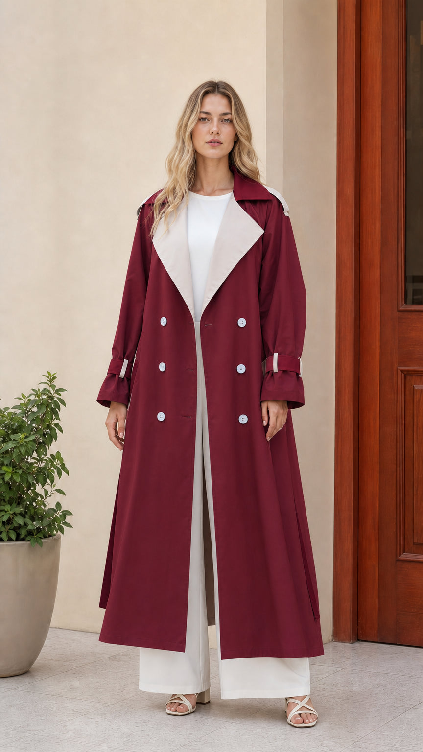 Front view of women's burgundy maxi trench coat with contrast lapel detail