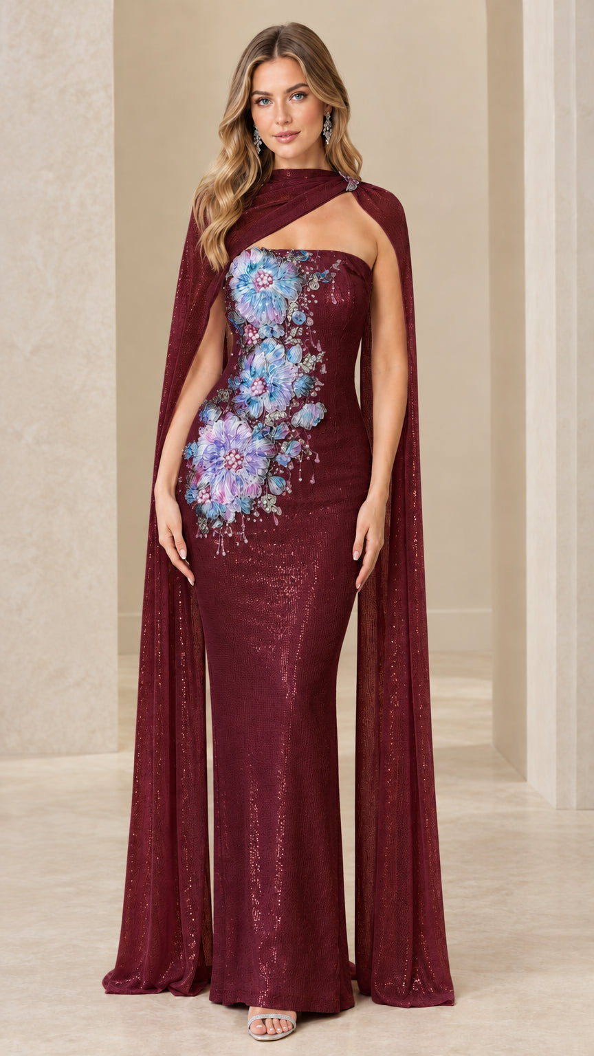 Burgundy floor-length column gown with floral embroidery and cape
