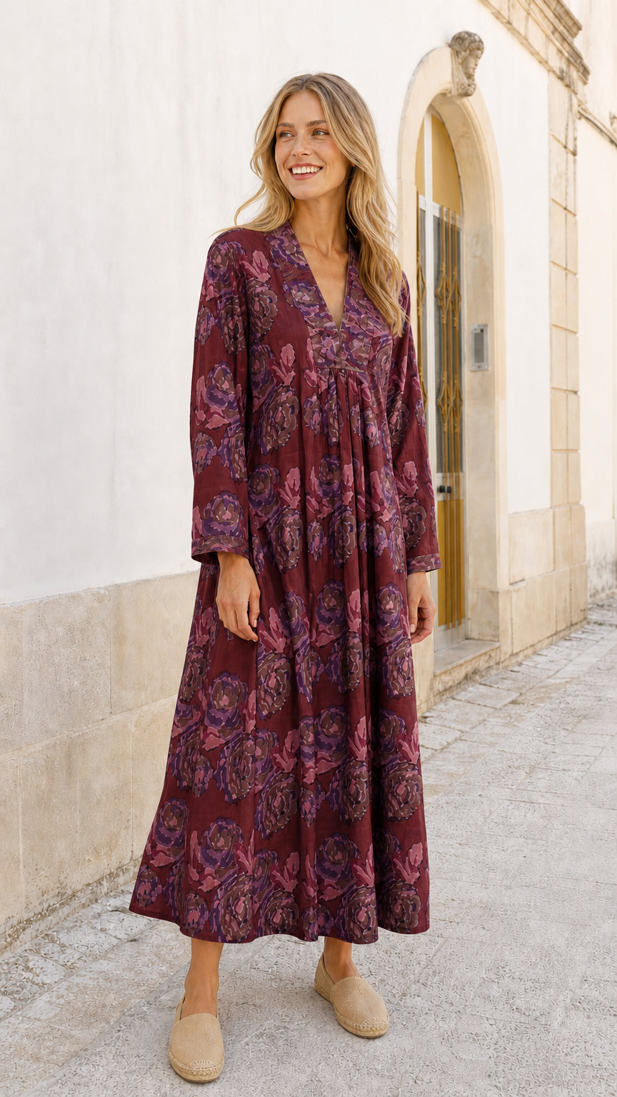 Model wearing burgundy floral maxi dress