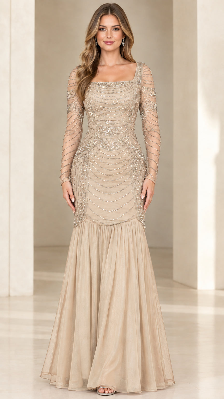 Front view of champagne gold beaded trumpet evening gown with sheer sleeves