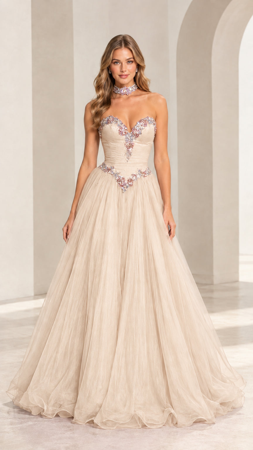 Model wearing champagne strapless crystal embellished tulle ball gown